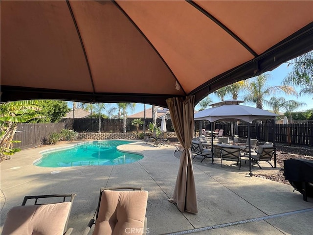 2653 Ashcroft Ave, Clovis, CA 93611 - view of pool with a patio area, a fenced in pool, a fenced backyard, outdoor dining space, and a gazebo