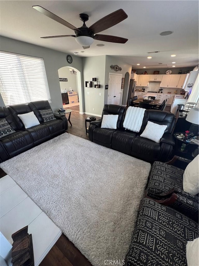 2653 Ashcroft Ave, Clovis, CA 93611 - living room with ceiling fan, recessed lighting, dark wood finished floors, and arched walkways