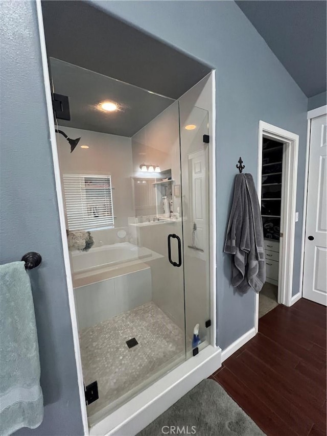 2653 Ashcroft Ave, Clovis, CA 93611 - bathroom featuring a garden tub, a shower stall, wood finished floors, and baseboards