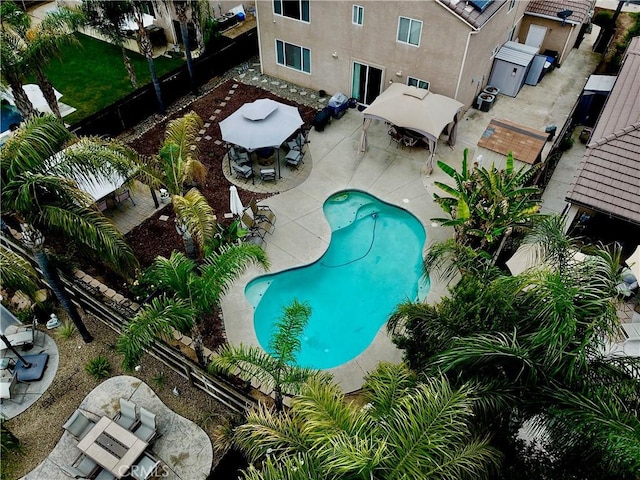2653 Ashcroft Ave, Clovis, CA 93611 - view of swimming pool with fence, a gazebo, a fenced in pool, a patio area, and outdoor dining space