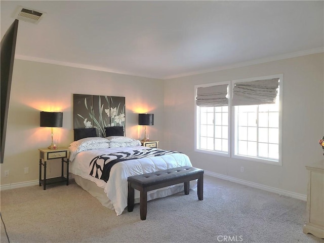 bedroom featuring visible vents, ornamental molding, and carpet flooring