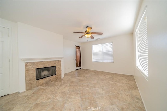 36877 Meadow Brook Way, Beaumont, CA 92223 - unfurnished living room with a tiled fireplace and ceiling fan