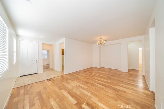 36877 Meadow Brook Way, Beaumont, CA 92223 - empty room with light wood-type flooring, a chandelier, and recessed lighting