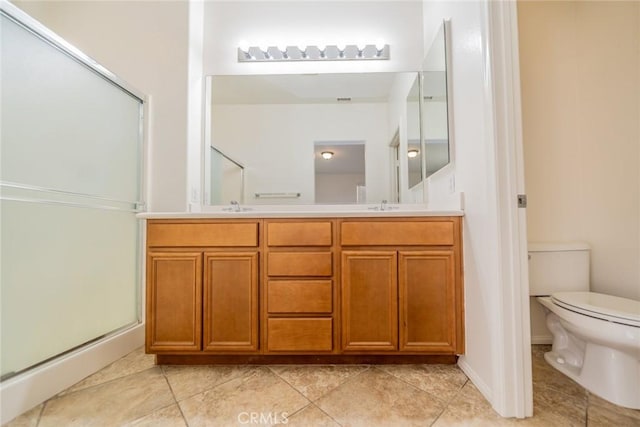 36877 Meadow Brook Way, Beaumont, CA 92223 - full bath with double vanity, a stall shower, toilet, and tile patterned flooring
