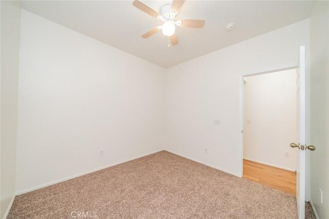 36877 Meadow Brook Way, Beaumont, CA 92223 - unfurnished room with carpet floors, baseboards, a smoke detector, and ceiling fan