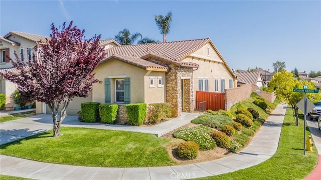 36877 Meadow Brook Way, Beaumont, CA 92223 - view of front of house featuring stucco siding, a tile roof, driveway, an attached garage, and stone siding