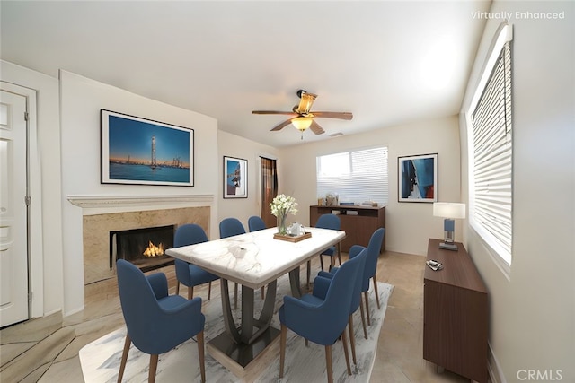 36877 Meadow Brook Way, Beaumont, CA 92223 - dining space with ceiling fan and a fireplace