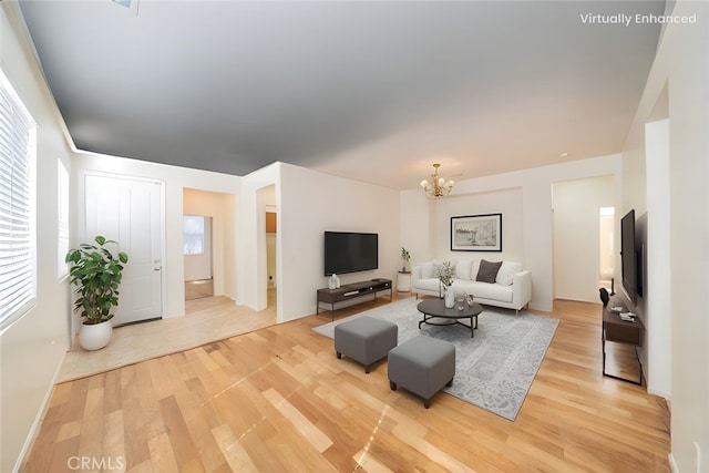 36877 Meadow Brook Way, Beaumont, CA 92223 - living area featuring light wood finished floors, a chandelier, and baseboards