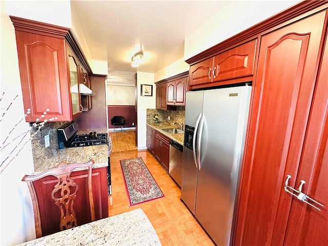 6225 Coldwater Canyon Ave Unit 117, North Hollywood, CA 91606 - kitchen featuring stainless steel appliances, a sink, light stone counters, and tasteful backsplash