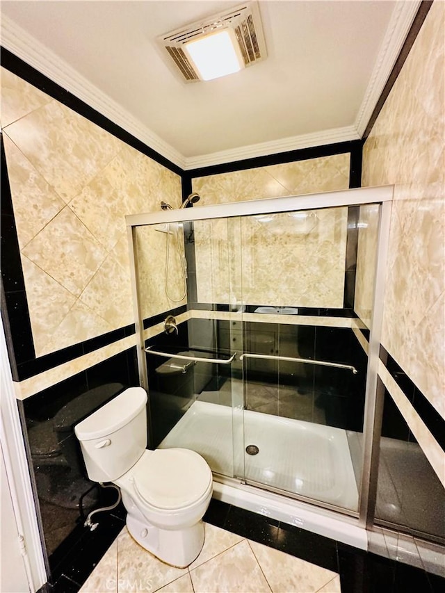 6225 Coldwater Canyon Ave Unit 117, North Hollywood, CA 91606 - bathroom with tile walls, toilet, visible vents, and crown molding
