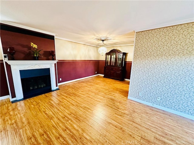 6225 Coldwater Canyon Ave Unit 117, North Hollywood, CA 91606 - unfurnished living room featuring baseboards, a chandelier, wallpapered walls, wood finished floors, and a fireplace