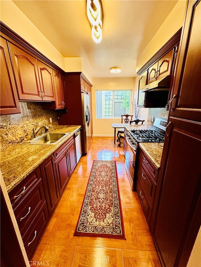 6225 Coldwater Canyon Ave Unit 117, North Hollywood, CA 91606 - kitchen featuring tasteful backsplash, appliances with stainless steel finishes, baseboards, and a sink