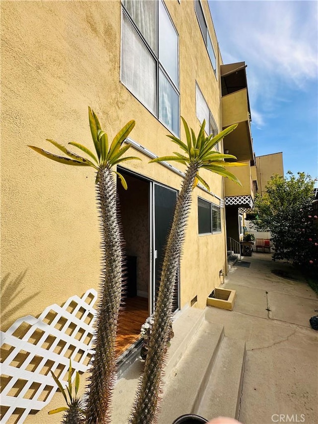 6225 Coldwater Canyon Ave Unit 117, North Hollywood, CA 91606 - property entrance featuring a patio area and stucco siding