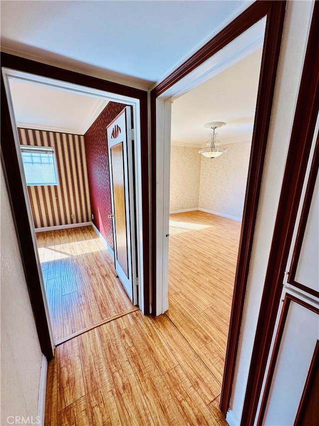 6225 Coldwater Canyon Ave Unit 117, North Hollywood, CA 91606 - hall with wallpapered walls, light wood-style floors, and crown molding