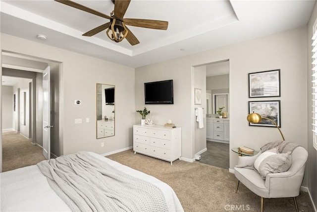 109 Baculo St, Rancho Mission Viejo, CA 92694 - carpeted bedroom with connected bathroom, baseboards, a ceiling fan, and a raised ceiling