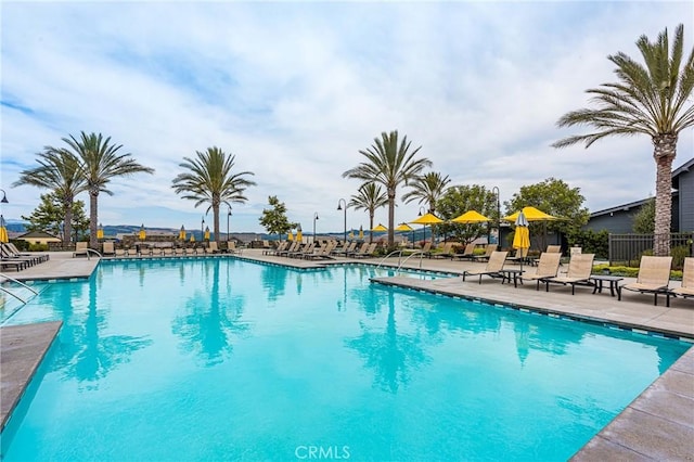 109 Baculo St, Rancho Mission Viejo, CA 92694 - community pool with a patio and fence