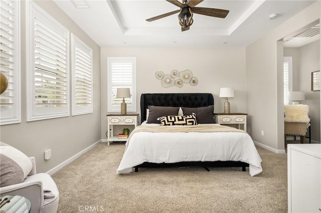 109 Baculo St, Rancho Mission Viejo, CA 92694 - carpeted bedroom with baseboards, a tray ceiling, and ceiling fan