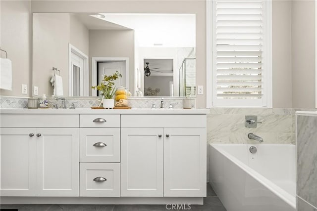 109 Baculo St, Rancho Mission Viejo, CA 92694 - full bathroom featuring a bath, double vanity, a shower stall, and a sink