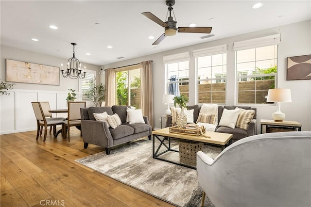 109 Baculo St, Rancho Mission Viejo, CA 92694 - living area featuring recessed lighting, light wood-style flooring, visible vents, and ceiling fan with notable chandelier