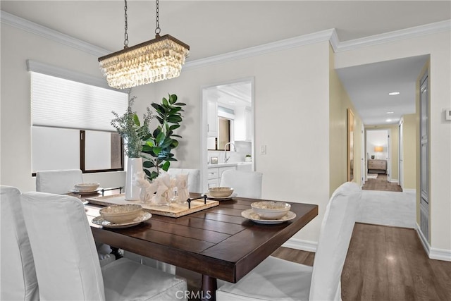 2357 Palos Verdes Dr W Unit 3, Palos Verdes Estates, CA 90274 - dining room with an inviting chandelier, crown molding, baseboards, and wood finished floors