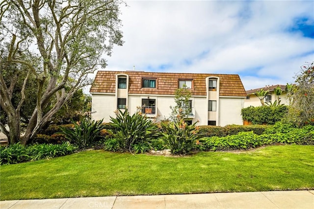 2357 Palos Verdes Dr W Unit 3, Palos Verdes Estates, CA 90274 - front facade with mansard roof, a front yard, and stucco siding