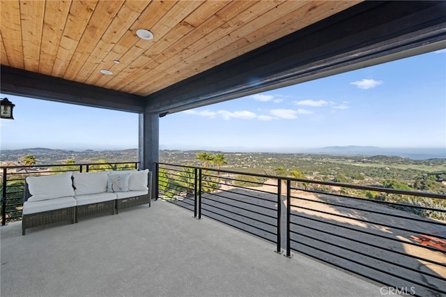balcony featuring an outdoor hangout area and a mountain view