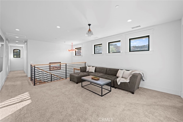 living room with carpet flooring, recessed lighting, and visible vents