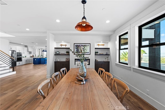 41950 Hacienda Dr, Murrieta, CA 92562 - dining room featuring light wood-style flooring, recessed lighting, stairway, and baseboards