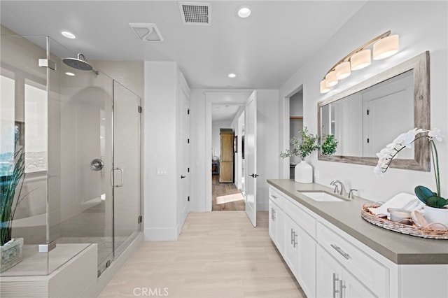 41950 Hacienda Dr, Murrieta, CA 92562 - full bath with vanity, a stall shower, recessed lighting, wood finished floors, and baseboards
