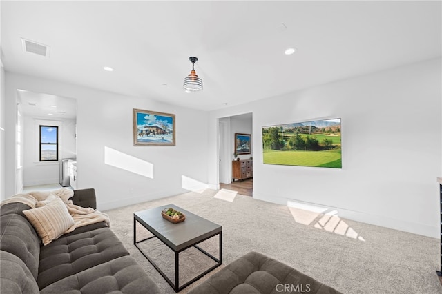 living area with carpet flooring, visible vents, baseboards, and recessed lighting
