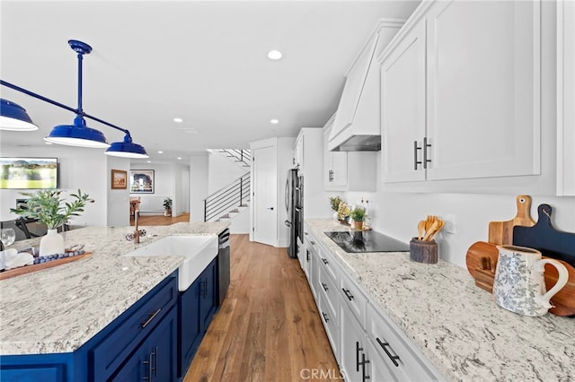 41950 Hacienda Dr, Murrieta, CA 92562 - kitchen featuring blue cabinets, a sink, black electric stovetop, white cabinetry, and recessed lighting