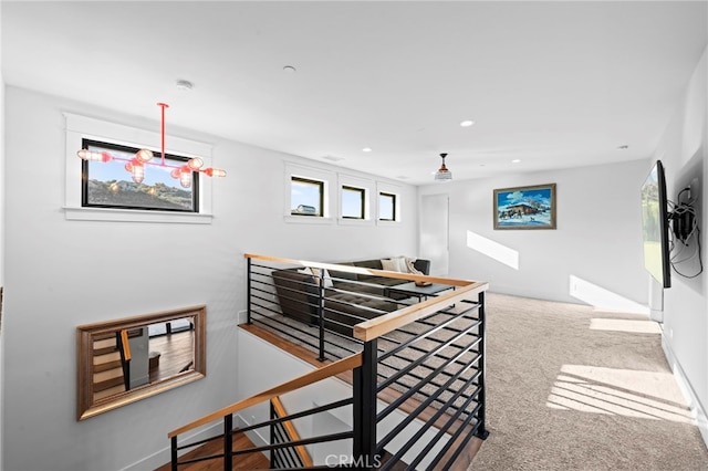 stairway featuring carpet floors, baseboards, and recessed lighting