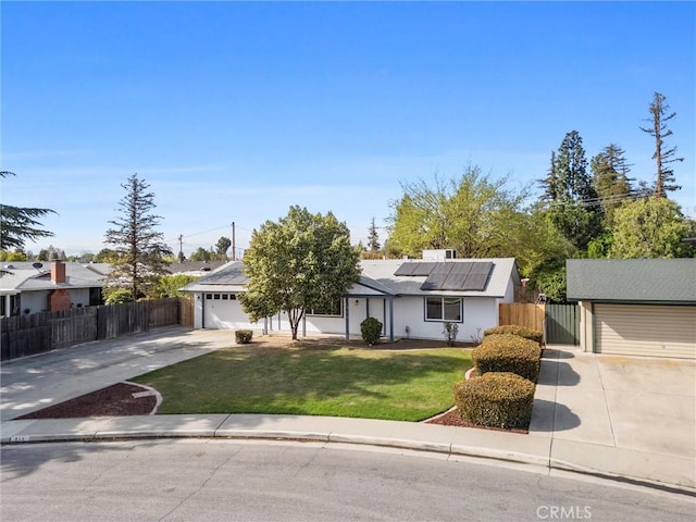 513 River Oaks Dr, Bakersfield, CA 93309 - ranch-style house featuring fence, driveway, a front yard, and solar panels