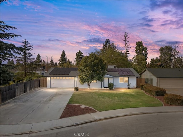 513 River Oaks Dr, Bakersfield, CA 93309 - single story home with roof mounted solar panels, driveway, a garage, and a front yard