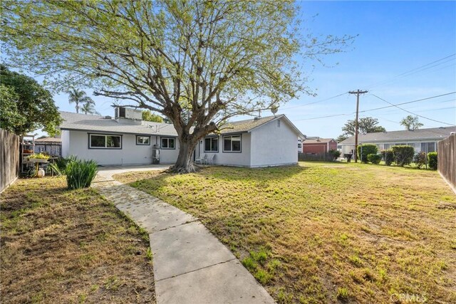 513 River Oaks Dr, Bakersfield, CA 93309 - view of front of property with a fenced backyard, stucco siding, and a front yard