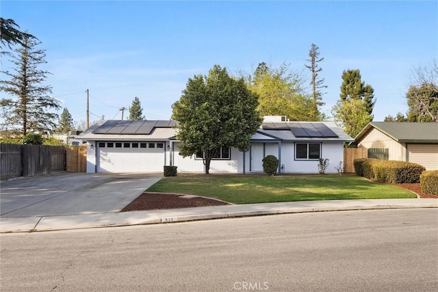 513 River Oaks Dr, Bakersfield, CA 93309 - ranch-style home with roof mounted solar panels, driveway, a front yard, and a garage