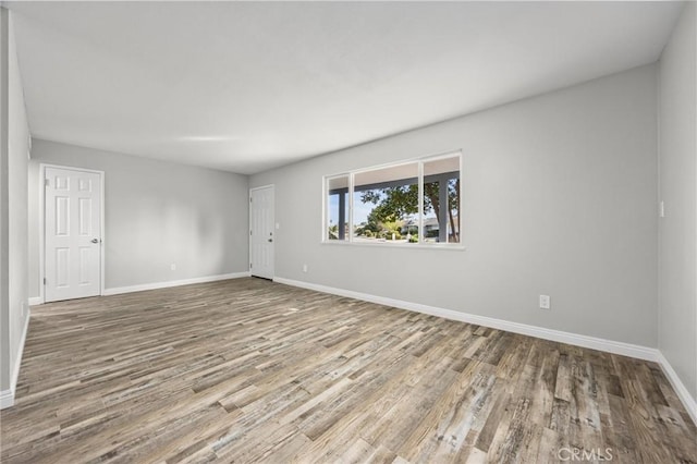 513 River Oaks Dr, Bakersfield, CA 93309 - unfurnished room featuring baseboards and wood finished floors
