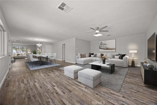 513 River Oaks Dr, Bakersfield, CA 93309 - living area with wood finished floors, visible vents, and baseboards