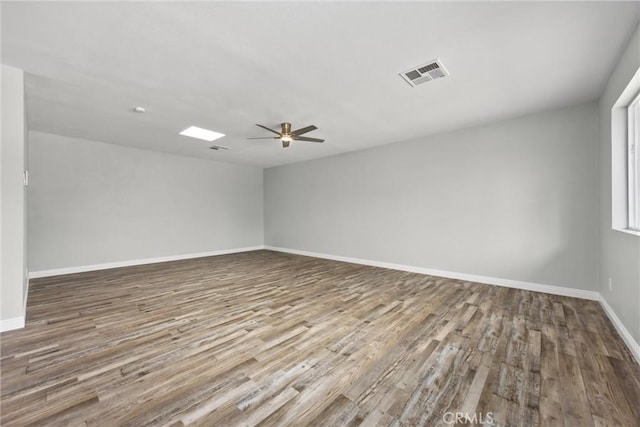 513 River Oaks Dr, Bakersfield, CA 93309 - empty room with ceiling fan, baseboards, wood finished floors, and visible vents