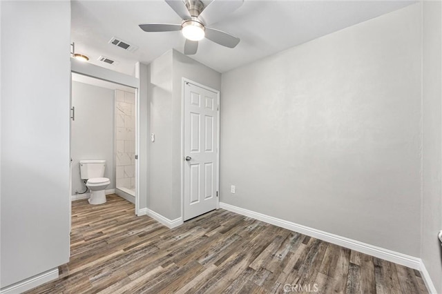513 River Oaks Dr, Bakersfield, CA 93309 - unfurnished bedroom featuring ensuite bath, baseboards, wood finished floors, and visible vents