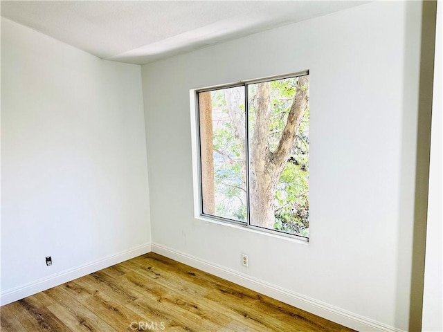 22703 Copper Hill Dr Unit 2, Saugus, CA 91350 - unfurnished room with wood finished floors, a wealth of natural light, and baseboards