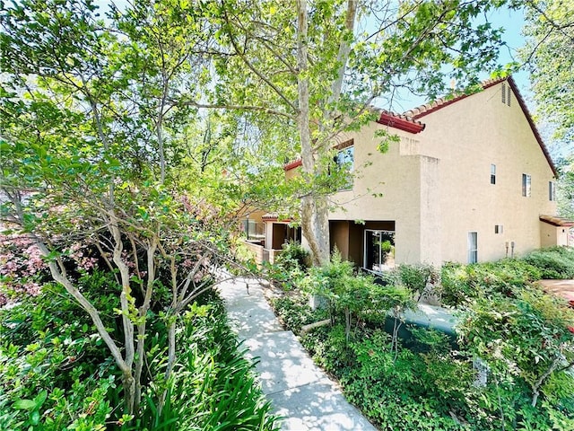 22703 Copper Hill Dr Unit 2, Saugus, CA 91350 - view of front facade featuring stucco siding and a tile roof