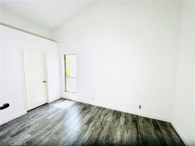 22703 Copper Hill Dr Unit 2, Saugus, CA 91350 - empty room featuring dark wood finished floors, baseboards, and lofted ceiling
