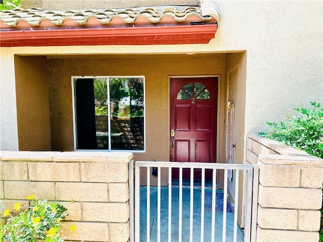 22703 Copper Hill Dr Unit 2, Saugus, CA 91350 - doorway to property with stucco siding and a tiled roof