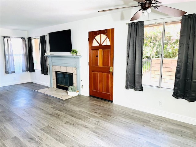 22703 Copper Hill Dr Unit 2, Saugus, CA 91350 - unfurnished living room with a ceiling fan, wood finished floors, and a healthy amount of sunlight