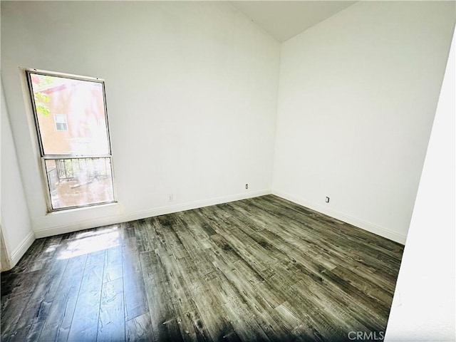 22703 Copper Hill Dr Unit 2, Saugus, CA 91350 - unfurnished room with vaulted ceiling, baseboards, and dark wood-style flooring