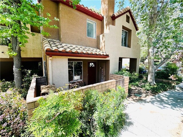 22703 Copper Hill Dr Unit 2, Saugus, CA 91350 - mediterranean / spanish-style house featuring stucco siding and a tile roof