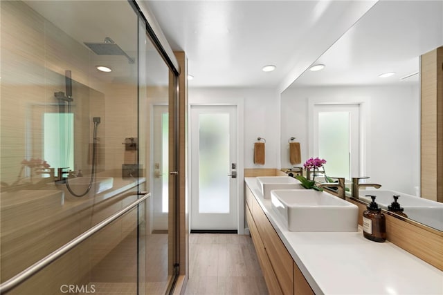 3120 Bern Dr, Laguna Beach, CA 92651 - full bathroom featuring double vanity, a stall shower, recessed lighting, and wood finished floors