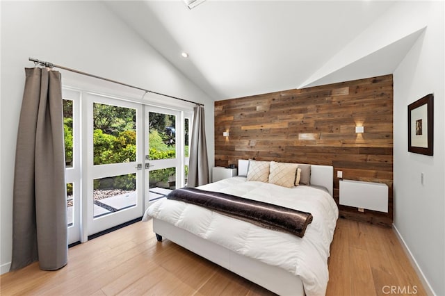 3120 Bern Dr, Laguna Beach, CA 92651 - bedroom with wooden walls, high vaulted ceiling, recessed lighting, access to exterior, and light wood-type flooring