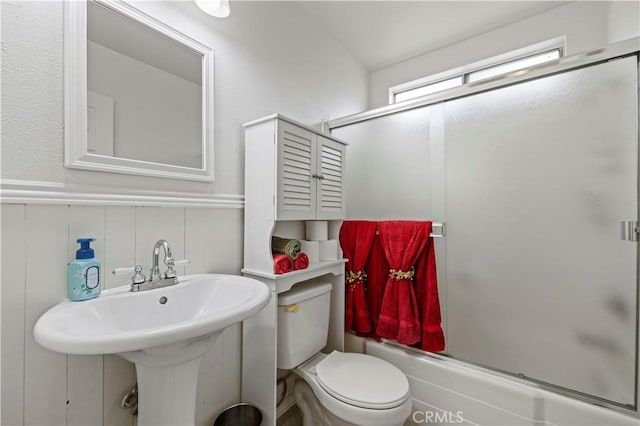 21643 Spice Ct, Saugus, CA 91350 - full bath with bath / shower combo with glass door and a wainscoted wall